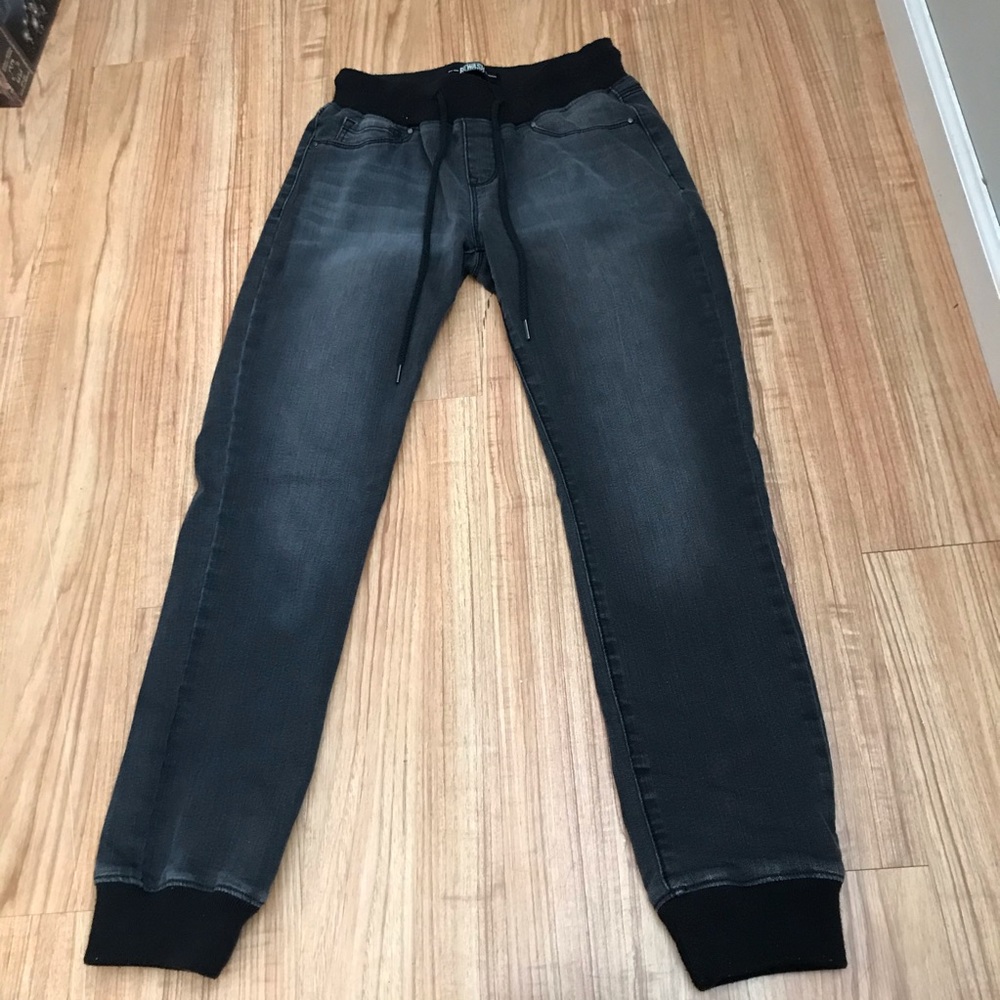 Grey jeans with black cuffs and waist band